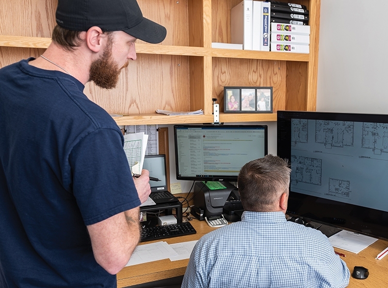 Wayne-J.-Griffin-Electric-Office-Worker-at-Desk_May-2024