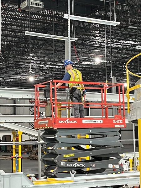 Wayne-J.-Griffin-Electric-Worker-on-Lift_2024
